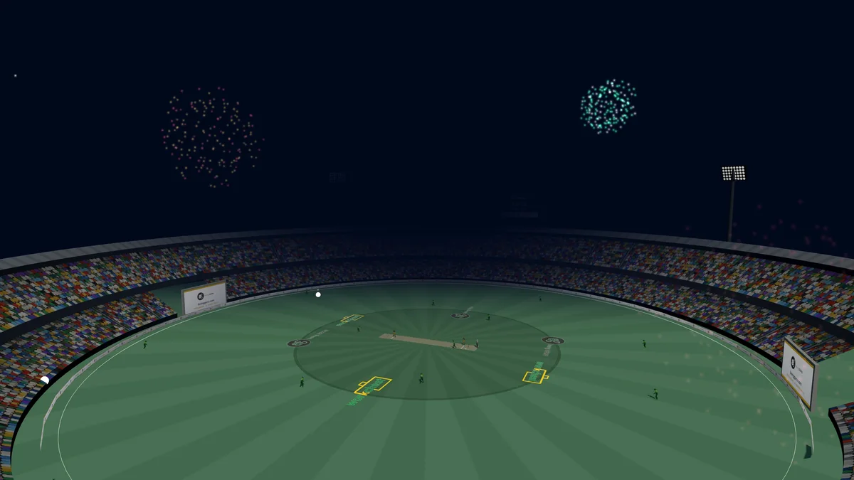 The end of a match in Howzat Live: fireworks burst over the stadium under lights, the ground lit by the floodlight towers and the crowd still in.